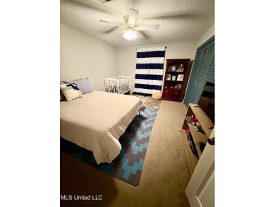 Beautifully updated 4 bedroom home is walking distance to the on Castlewoods Golf Club in Mississippi - for sale on GolfHomes.com, golf home, golf lot