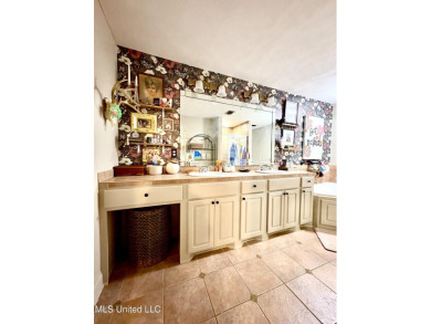 Beautifully updated 4 bedroom home is walking distance to the on Castlewoods Golf Club in Mississippi - for sale on GolfHomes.com, golf home, golf lot