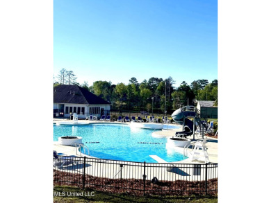 Beautifully updated 4 bedroom home is walking distance to the on Castlewoods Golf Club in Mississippi - for sale on GolfHomes.com, golf home, golf lot
