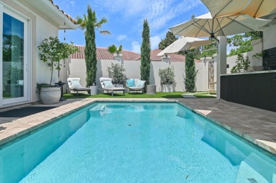 Step into a home that feels like a private resort--where indoor on Regatta Bay Golf and Country Club in Florida - for sale on GolfHomes.com, golf home, golf lot