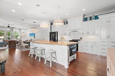 Step into a home that feels like a private resort--where indoor on Regatta Bay Golf and Country Club in Florida - for sale on GolfHomes.com, golf home, golf lot