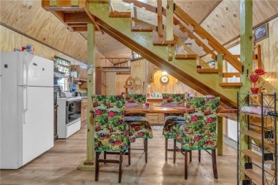 Enjoy lakeside living with this charming and move-in ready cabin on Sugar Valley Lakes Golf Course in Kansas - for sale on GolfHomes.com, golf home, golf lot