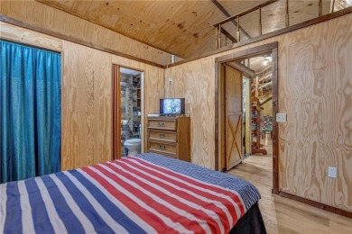 Enjoy lakeside living with this charming and move-in ready cabin on Sugar Valley Lakes Golf Course in Kansas - for sale on GolfHomes.com, golf home, golf lot
