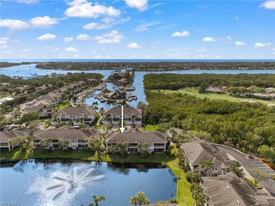 Nicely appointed first floor coach home located directly across on Windstar on Naples Bay in Florida - for sale on GolfHomes.com, golf home, golf lot