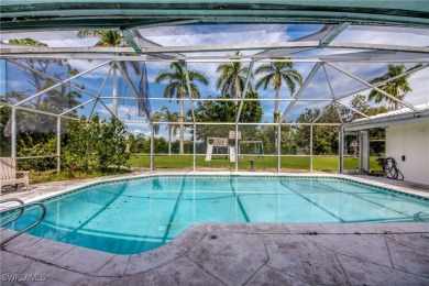 Diamond in the rough Estate home overlooking the #5 hole of on Cypress Lake Country Club in Florida - for sale on GolfHomes.com, golf home, golf lot