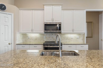 Luxurious 4-Bedroom Pool Home in Prestigious Plantation Bay's on Plantation Bay Golf and Country Club in Florida - for sale on GolfHomes.com, golf home, golf lot