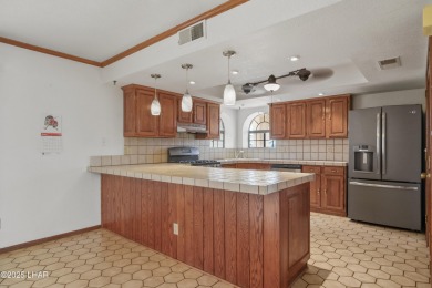 Welcome to a home filled with laughter, warmth, and on Chaparral Golf and Country Club in Arizona - for sale on GolfHomes.com, golf home, golf lot