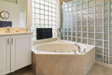 Luxurious 4-Bedroom Pool Home in Prestigious Plantation Bay's on Plantation Bay Golf and Country Club in Florida - for sale on GolfHomes.com, golf home, golf lot