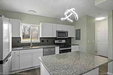 Welcome to your dream home! This stunningly updated home offers on Rush Lake Hills Golf Club in Michigan - for sale on GolfHomes.com, golf home, golf lot