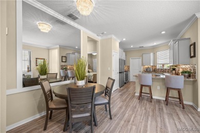 Welcome to this bright, open, and impeccably upgraded 2-bedroom on River Greens Golf Course in Florida - for sale on GolfHomes.com, golf home, golf lot