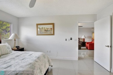 Enjoy the spectacular LAKE view from this beautiful 2/2 located on Flamingo Lakes Country Club in Florida - for sale on GolfHomes.com, golf home, golf lot