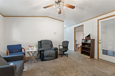 Discover this charming 2-bedroom, 2-bath retreat nestled under a on Links At Lands End in Texas - for sale on GolfHomes.com, golf home, golf lot