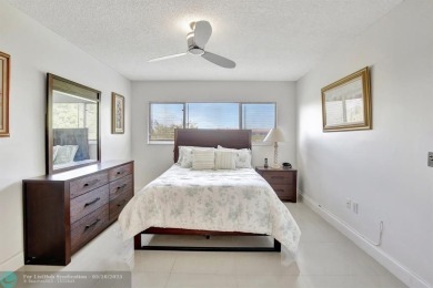 Enjoy the spectacular LAKE view from this beautiful 2/2 located on Flamingo Lakes Country Club in Florida - for sale on GolfHomes.com, golf home, golf lot