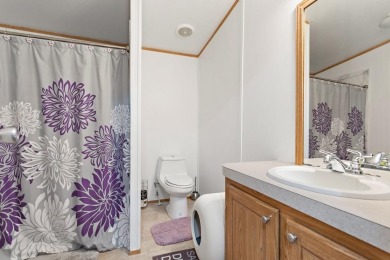 Discover this charming 2-bedroom, 2-bath retreat nestled under a on Links At Lands End in Texas - for sale on GolfHomes.com, golf home, golf lot