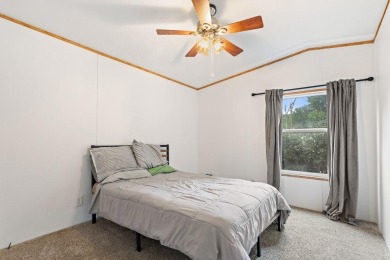 Discover this charming 2-bedroom, 2-bath retreat nestled under a on Links At Lands End in Texas - for sale on GolfHomes.com, golf home, golf lot