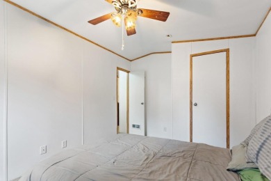 Discover this charming 2-bedroom, 2-bath retreat nestled under a on Links At Lands End in Texas - for sale on GolfHomes.com, golf home, golf lot