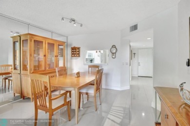 Enjoy the spectacular LAKE view from this beautiful 2/2 located on Flamingo Lakes Country Club in Florida - for sale on GolfHomes.com, golf home, golf lot