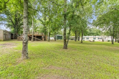 Discover this charming 2-bedroom, 2-bath retreat nestled under a on Links At Lands End in Texas - for sale on GolfHomes.com, golf home, golf lot