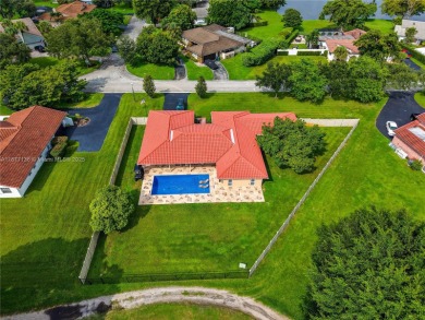 Rarely available 5-bed, 3.5-bath home on an oversized lot with on  in Florida - for sale on GolfHomes.com, golf home, golf lot