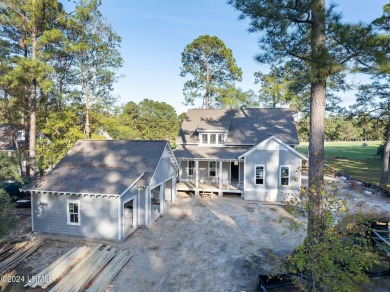 This charming Lowcountry home combines Southern style porches on Oldfield Golf Club in South Carolina - for sale on GolfHomes.com, golf home, golf lot