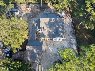 This charming Lowcountry home combines Southern style porches on Oldfield Golf Club in South Carolina - for sale on GolfHomes.com, golf home, golf lot