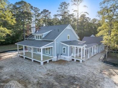 This charming Lowcountry home combines Southern style porches on Oldfield Golf Club in South Carolina - for sale on GolfHomes.com, golf home, golf lot