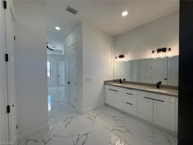 Welcome to a breathtaking new construction single-family home on Del Tura Golf and Country Club in Florida - for sale on GolfHomes.com, golf home, golf lot