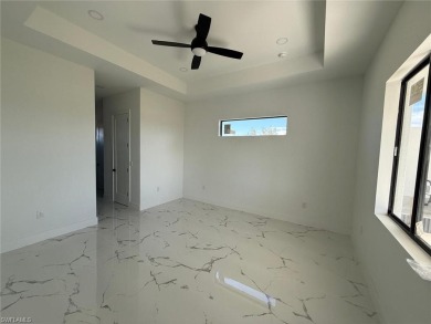 Welcome to a breathtaking new construction single-family home on Del Tura Golf and Country Club in Florida - for sale on GolfHomes.com, golf home, golf lot