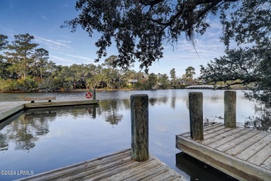 This charming Lowcountry home combines Southern style porches on Oldfield Golf Club in South Carolina - for sale on GolfHomes.com, golf home, golf lot