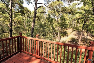 Special setting in Tahitian Village! 2016 built home overlooks a on Pine Forest Golf Club in Texas - for sale on GolfHomes.com, golf home, golf lot