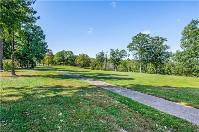 You'll enjoy this Holiday Island getaway on the 19-hole golf on Holiday Island Golf Course in Arkansas - for sale on GolfHomes.com, golf home, golf lot