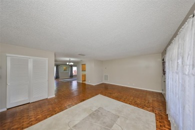 PRICED WELL UNDER APPRAISAL!  Welcome to the vibrant senior on Mainlands Golf Club in Florida - for sale on GolfHomes.com, golf home, golf lot