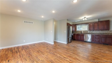 Check out this beautiful home located in a peaceful no wake cove on Seasons Ridge At Four Seasons in Missouri - for sale on GolfHomes.com, golf home, golf lot