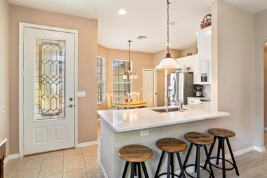 TRULY A MUST SEE SINGLE-STORY CBS HOME located in the desirable on Monarch At Royal Highlands in Florida - for sale on GolfHomes.com, golf home, golf lot