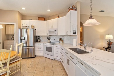 TRULY A MUST SEE SINGLE-STORY CBS HOME located in the desirable on Monarch At Royal Highlands in Florida - for sale on GolfHomes.com, golf home, golf lot