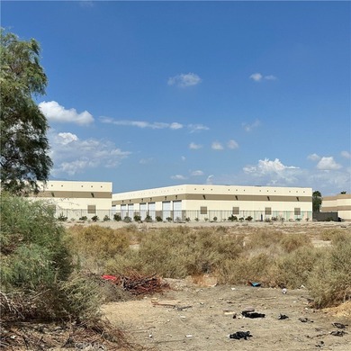 The lot in the entry of a two Hotels complex-Comfort Inn and on Palm Desert Country Club in California - for sale on GolfHomes.com, golf home, golf lot