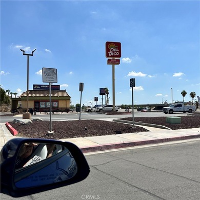 The lot in the entry of a two Hotels complex-Comfort Inn and on Palm Desert Country Club in California - for sale on GolfHomes.com, golf home, golf lot