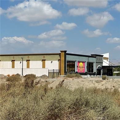 The lot in the entry of a two Hotels complex-Comfort Inn and on Palm Desert Country Club in California - for sale on GolfHomes.com, golf home, golf lot