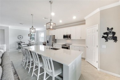 Welcome to this stunning coach home in the highly sought-after on Bonita National Golf Course in Florida - for sale on GolfHomes.com, golf home, golf lot