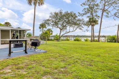 Beautifully updated 3 bed, 2 bath waterfront home with on New Smyrna Beach Golf Course in Florida - for sale on GolfHomes.com, golf home, golf lot