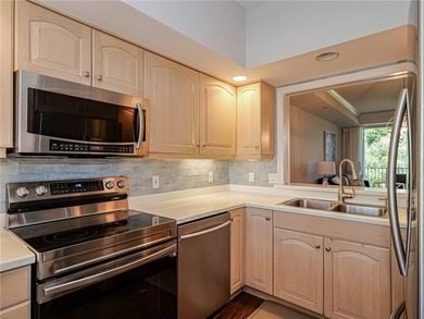 Elegant Country Club living in this second floor condo built by on Oak Harbor Country Club in Florida - for sale on GolfHomes.com, golf home, golf lot