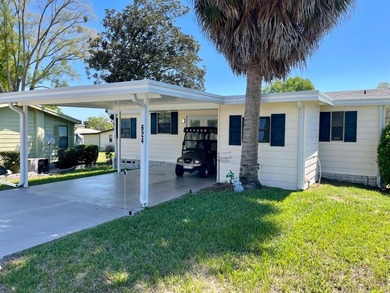 This home comes complete and with a Golf Cart!! Just bring your on Water Oak Country Club Estates in Florida - for sale on GolfHomes.com, golf home, golf lot