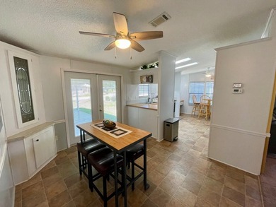 This home comes complete and with a Golf Cart!! Just bring your on Water Oak Country Club Estates in Florida - for sale on GolfHomes.com, golf home, golf lot