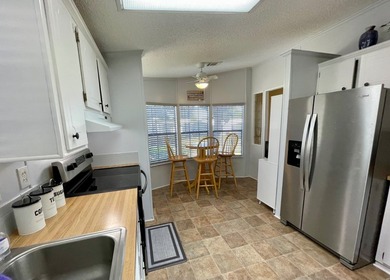 This home comes complete and with a Golf Cart!! Just bring your on Water Oak Country Club Estates in Florida - for sale on GolfHomes.com, golf home, golf lot