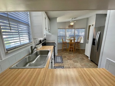 This home comes complete and with a Golf Cart!! Just bring your on Water Oak Country Club Estates in Florida - for sale on GolfHomes.com, golf home, golf lot