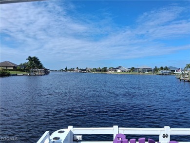 WOW! 2024 Gulf Access Pool Home on a Wide Canal - One Bridge to on Burnt Store Golf Club in Florida - for sale on GolfHomes.com, golf home, golf lot