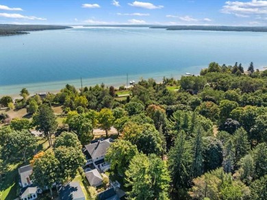 Built on a spacious scenic lot on the north side of Downtown on Charlevoix Golf Club in Michigan - for sale on GolfHomes.com, golf home, golf lot