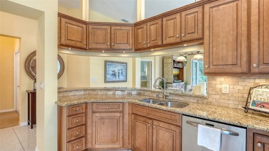 Under contract-accepting backup offers. $75,000 PRICE ADJUSTMENT on University Park Country Club in Florida - for sale on GolfHomes.com, golf home, golf lot