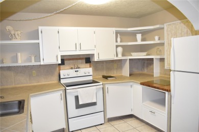Spacious 2/2 on ground floor with views to the well maintained on Woodmont Country Club in Florida - for sale on GolfHomes.com, golf home, golf lot
