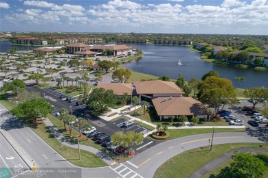 Enjoy the spectacular LAKE view from this beautiful 2/2 located on Flamingo Lakes Country Club in Florida - for sale on GolfHomes.com, golf home, golf lot